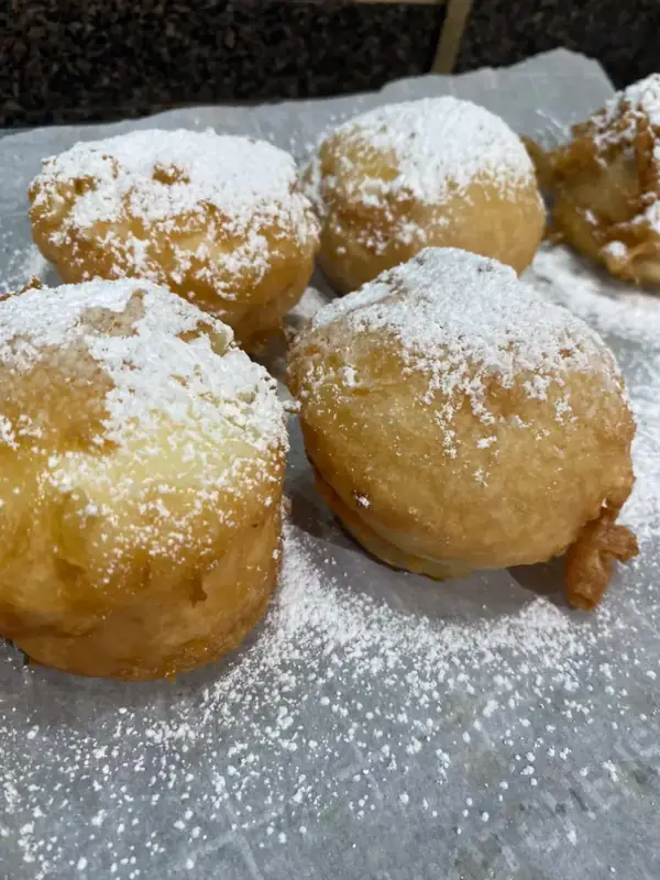 Deep fried cupcakes dusted with powdered sugar
