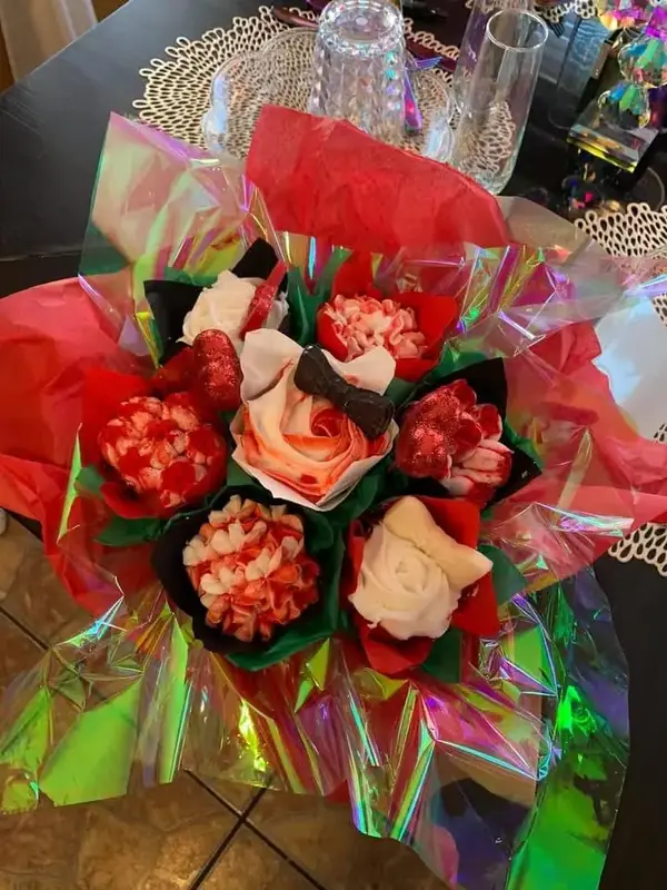 Red and white cupcake bouquet wrapped as a gift