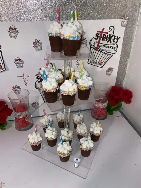 Hot cocoa bomb cups displayed on a tiered stand