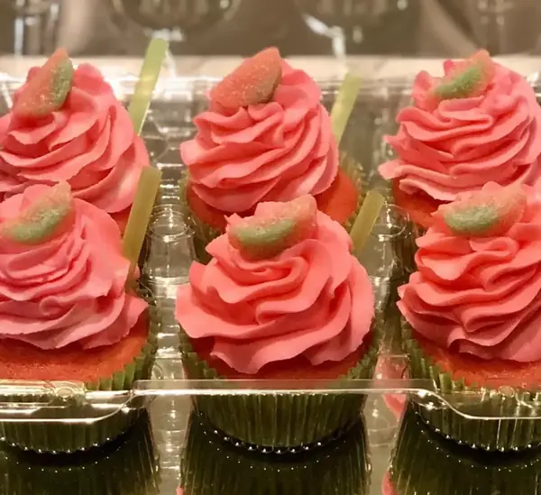 Half dozen cupcakes with pink buttercream swirls