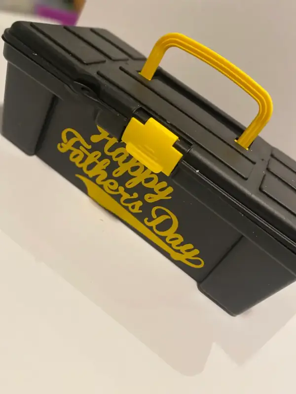 Yellow toolbox dessert gift labeled Happy Father's Day